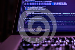 close up laptop computer screen with a programming code creating