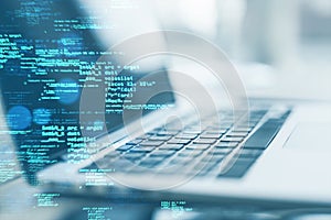 Close up of laptop on desk with creative coding html language on blurry background. Web developer and programming concept. Double