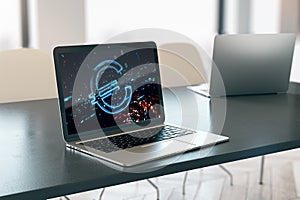 Close up of laptop on desktop with digital euro icon on background. Trade, finance and money concept. 3D Rendering