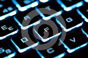 Close-up of laptop keyboard illumination, backlit keyboard
