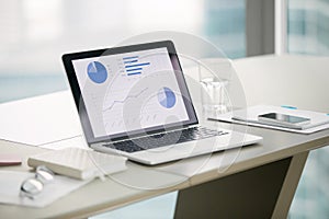 Close up of a laptop on a modern office desk photo