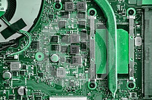 Close up of laptop processor with empty socket base for CPU and integrated graphics card on main board of notebook