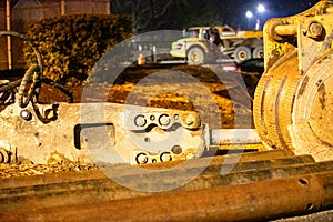 Close-up of large Construction Equipment in an Evening Background.