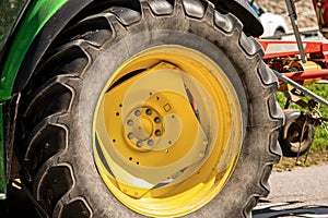 Close-up of a large wheel of a tractor with tire