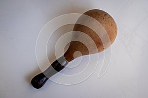 Close up of a wooden percussion instrument, ethnic rattle photo