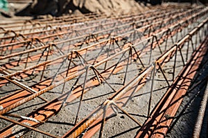 Close up on lattice girder and truss girders steel roof truss for concrete precast with ceramic elements ready for installation on