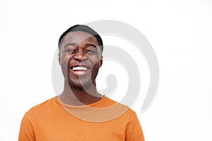 Close up laughing african american man against isolated white background