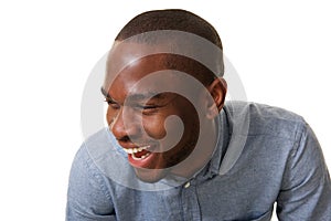 Close up laughing black man against isolated white background