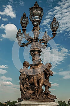 Close-up of the the lavishly decorated lamp on the Alexandre III bridge at the Seine river in Paris.