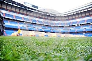 Close up of lawn with marking at empty football stadium photo