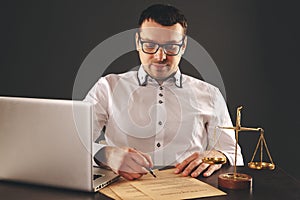 Close up lawyer businessman working or reading lawbook in office workplace.