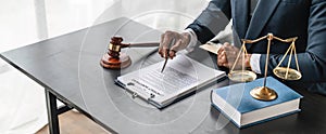 Close up lawyer businessman working or reading lawbook in office workplace for consultant lawyer concept.