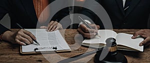 Close up lawyer businessman working or reading lawbook in office workplace for consultant lawyer concept.Lawyer working