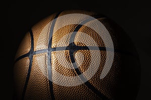 A close-up of a leather basketball on white