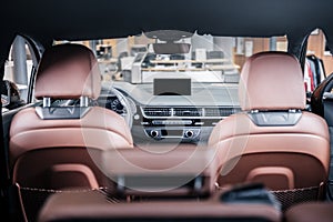 Close up of leather brown car interior from inside