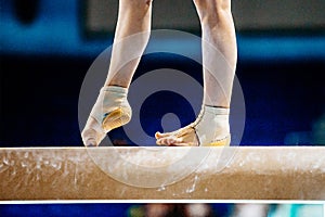 close-up legs female gymnast step on balance beam