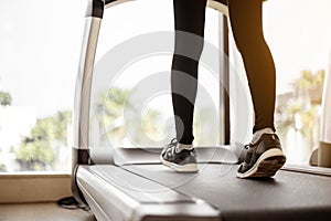 Close up legs woman doing exercise workout treadmill at gym