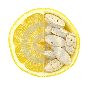 Close up of lemon and pills isolated