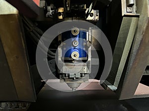 Close-up of the lens and nozzle of a laser cutting machine. metalworking industry