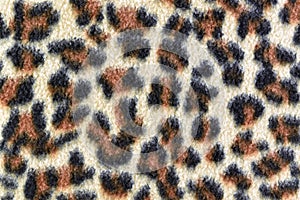 Close-up leopard pattern carpet, abstract texture background
