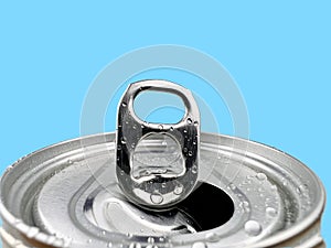 Close up Lid opens soft drink can and drops of water