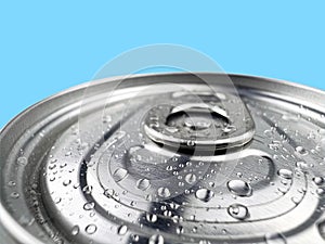 Close up Lid soft drink can and drops of water blue background