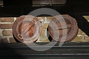 Close-up of lids of old milk cans