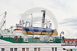 Close up lifeboat on cargo ship in the port