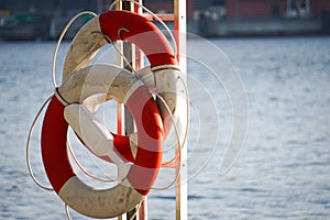 close-up of lifebuoys by the water