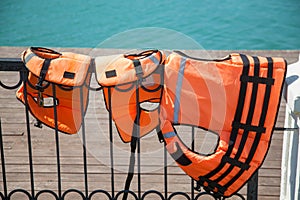 Close-up of Lifejackets on the lake in the background