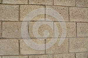 Close up of light brown brick stone wall texture grunge background