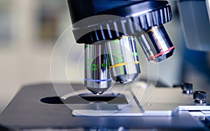 A close up light microscope for pharmaceutical bioscience research. Concept of science, laboratory and study of diseases