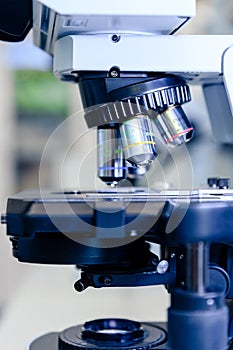 A close up light microscope for pharmaceutical bioscience research. Concept of science, laboratory and study of diseases.