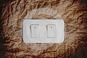 Close-up light switch on concrete wall