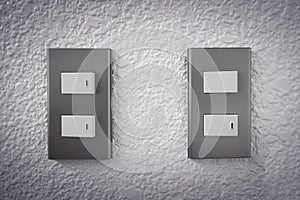 Close up of light switch with sunlight and shadow on white background, turn on and turn off, copy space,