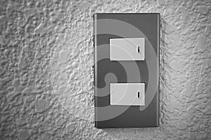 Close up of light switch with sunlight and shadow on white background, turn on and turn off, copy space,