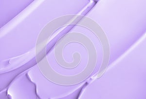 Close-up light violet cream lotion moisturiser smear smudge wavy texture. Skincare beauty product. Shampoo or hair