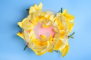 Close up of Lily flowers and card on blue background