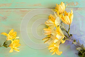 Close up of Lily flowers on the wooden background.