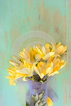 Close up of Lily flowers on the wooden background.