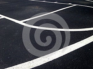 Close up of lines on am outdoor basketball court