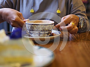 Close-up of the lips of a girl drinking coffee