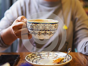 Close-up of the lips of a girl drinking coffee