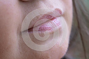 close up lips of mature female face, happy 50-year-old woman with gentle smile, Cosmetology and Skincare concept, Maturity and