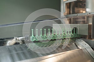 Close-up on liquid medicine production and focus on Pills During Enema Production and Packing Process on Modern Pharmaceutical