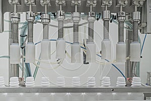 Close-up on liquid medicine production and focus on Pills During Enema Production and Packing Process on Modern Pharmaceutical