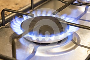 Close up lit gas hob burner
