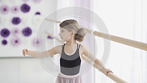 Close up of Little Ballerina In Pointe Practicing Dance At Classical Ballet School