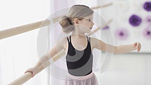 Close up of Little Ballerina In Pointe Practicing Dance At Classical Ballet School