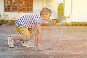 Close up of little boy get start running selective focus.